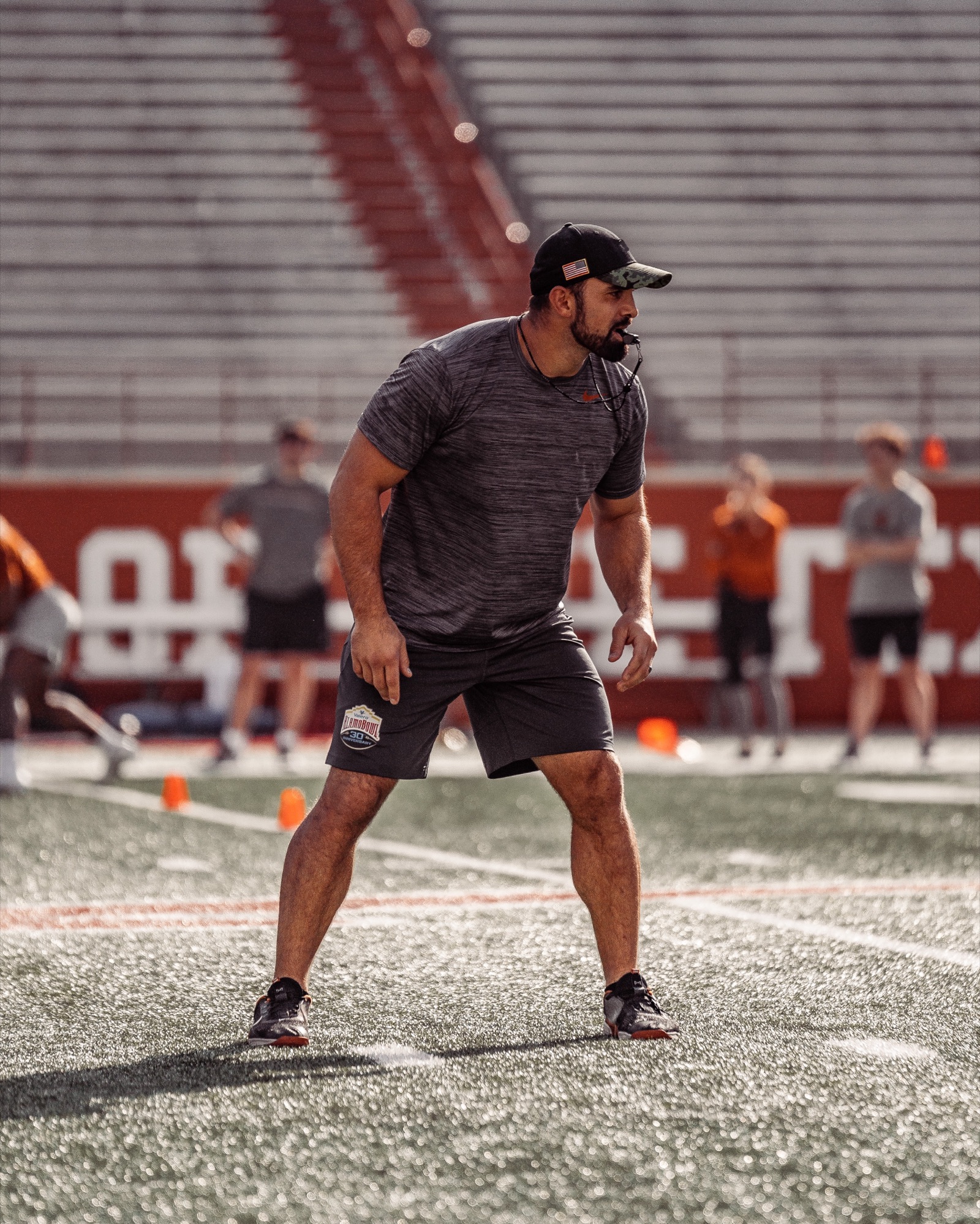 Cory Castro coaching on the field